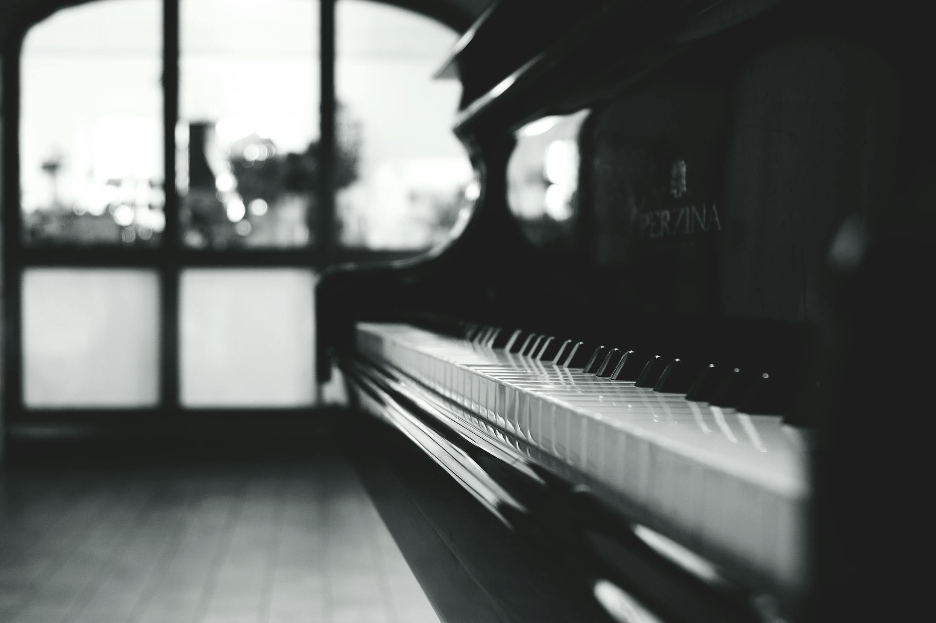 Black grand piano in an elegant room